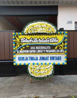 Papan Bunga Duka di Sugio
